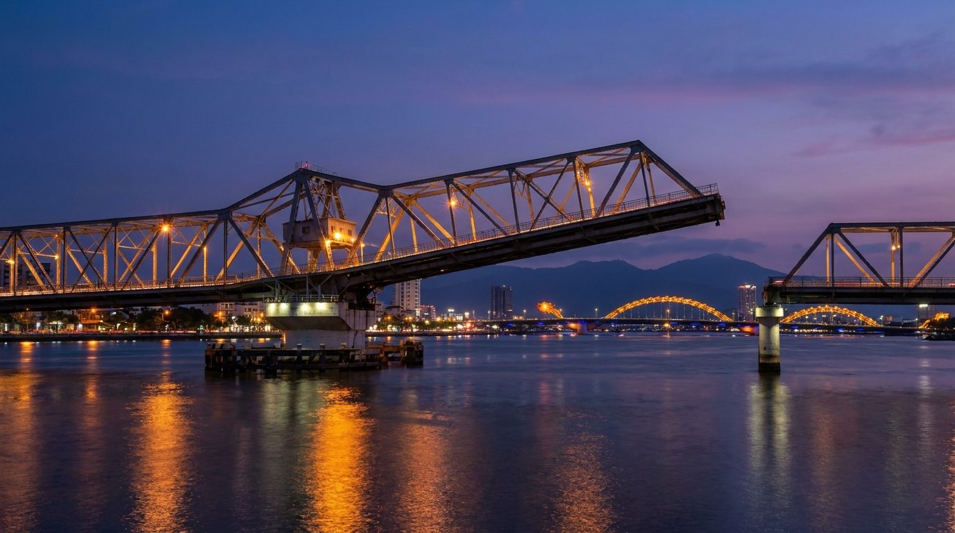 Han River Drawbridge rotating at night, steel structure against Da Nang city lights